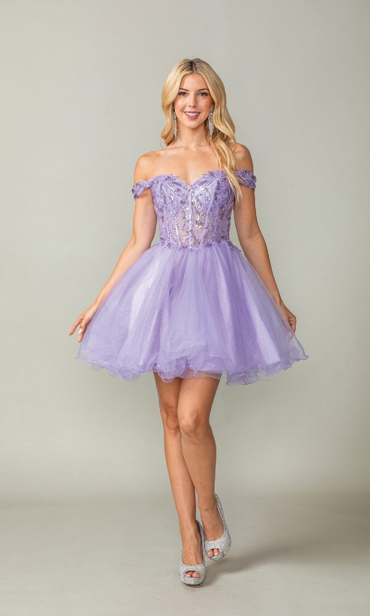 Woman wearing a purple off-shoulder dress against a plain background